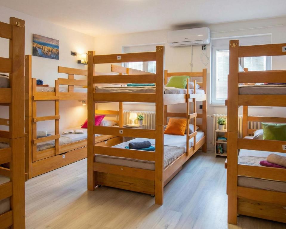 a room with four bunk beds in a house at BGD Downtown Hostel in Belgrade