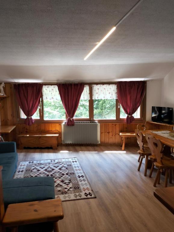 a living room with a couch and a table at Casa Rita - Pila in Gressan