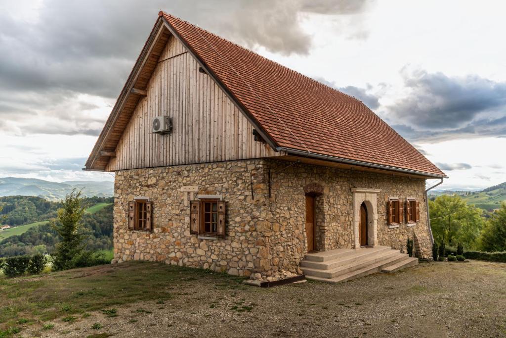 a small stone building on top of a hill at Vila Podigrac in Zgornja Kungota