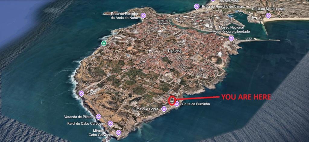 a map of a island with a red arrow at SwordFish Cliff Apartment in Peniche