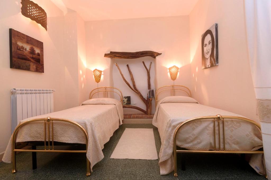 Postel nebo postele na pokoji v ubytování Al Vecchio Corso B&B