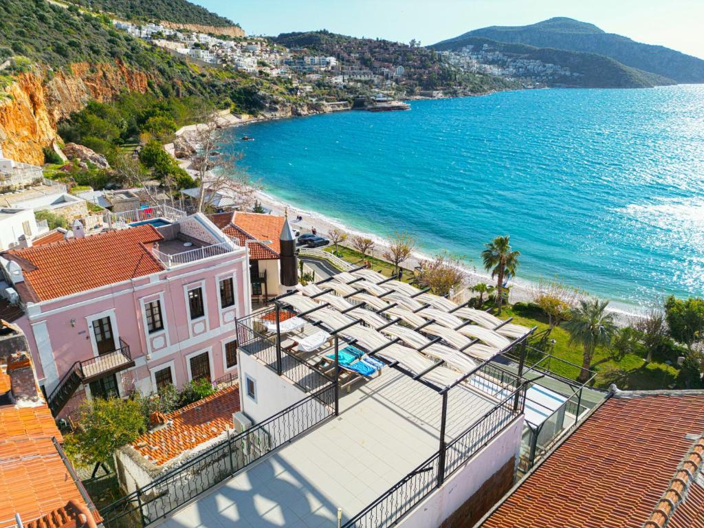 an aerial view of a beach and a building at The Place Boutique Hotel Kalkan in Kalkan