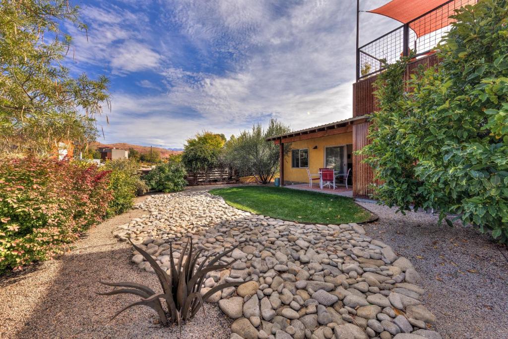 a house with a stone path leading to a yard at The Kayenta Flat in Moab UT in Moab