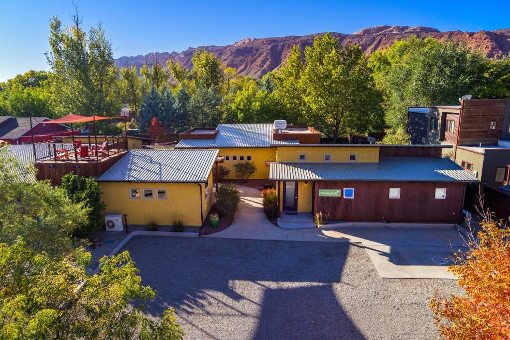 an aerial view of a building with mountains in the background at The Wingate Flat 4 in Moab