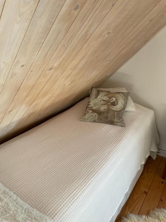 a bed with a picture of a ram on it at Fårhuset at Åkarp in Trelleborg