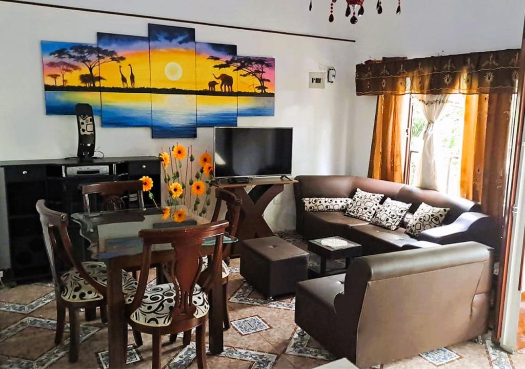 a living room with a couch and a table at samargo in Cali