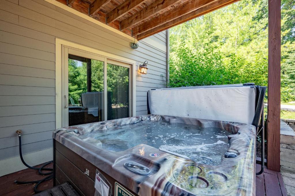 a hot tub on the back of a house at Dream On by Railey Vacations in Oakland
