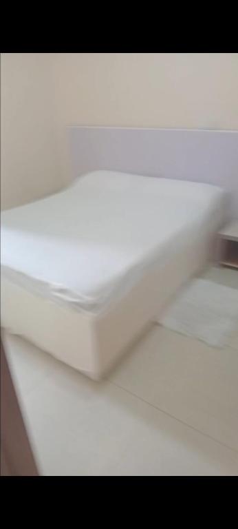 En eller flere senge i et værelse på Guest house