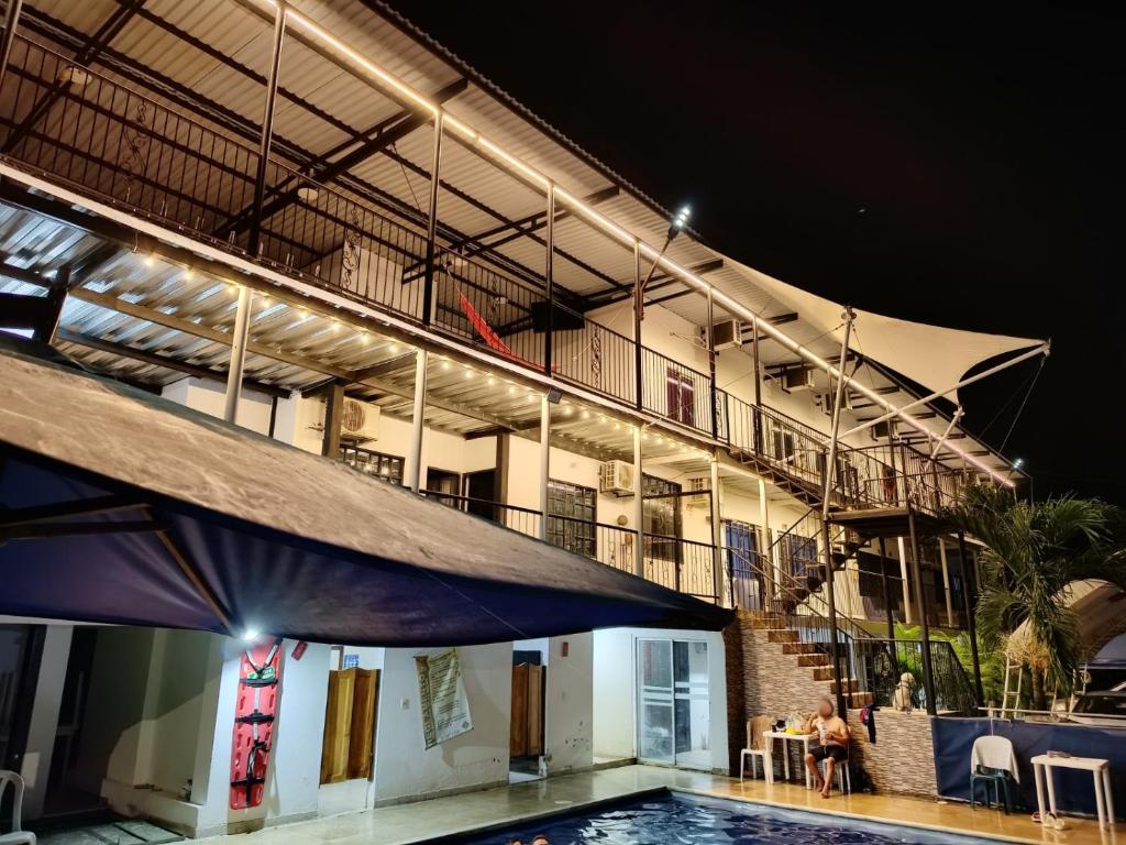a large building with a swimming pool at night at Santo Domingo Centro Vacacional in Jerusalén