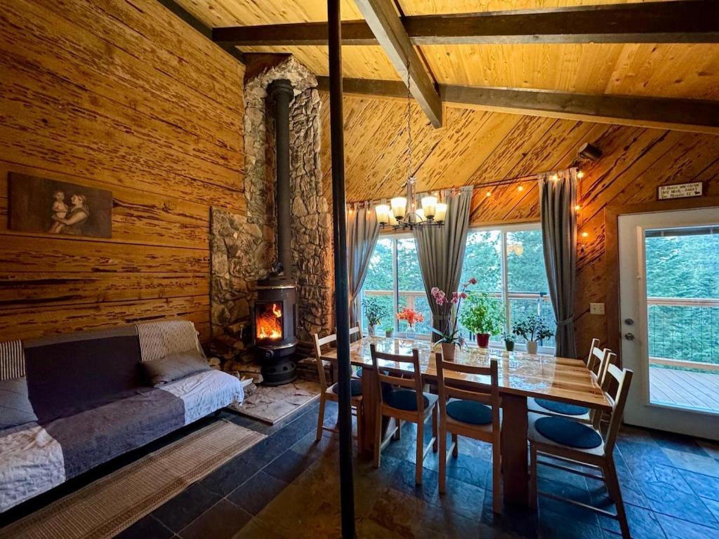 a dining room with a table and a fireplace at Mountain Cabin at Heavenly in Stateline
