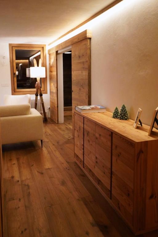 a living room with a table and a couch at Sky nest - Matterhorn in Breuil-Cervinia