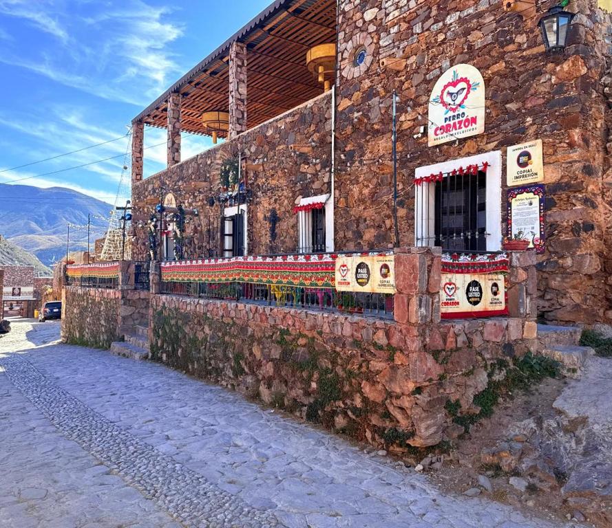 a building with a sign on the side of it at Hotel Ruinas Del Real in Real de Catorce