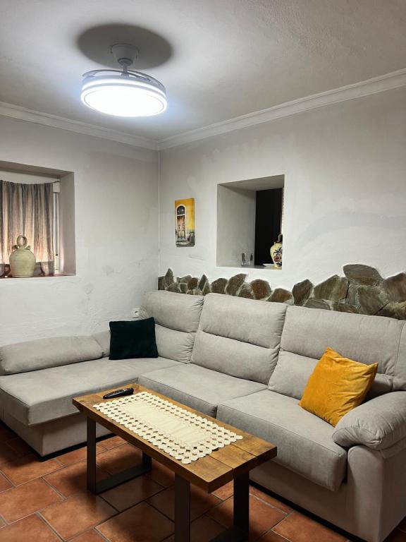 a living room with a couch and a table at La Casita in Ardales