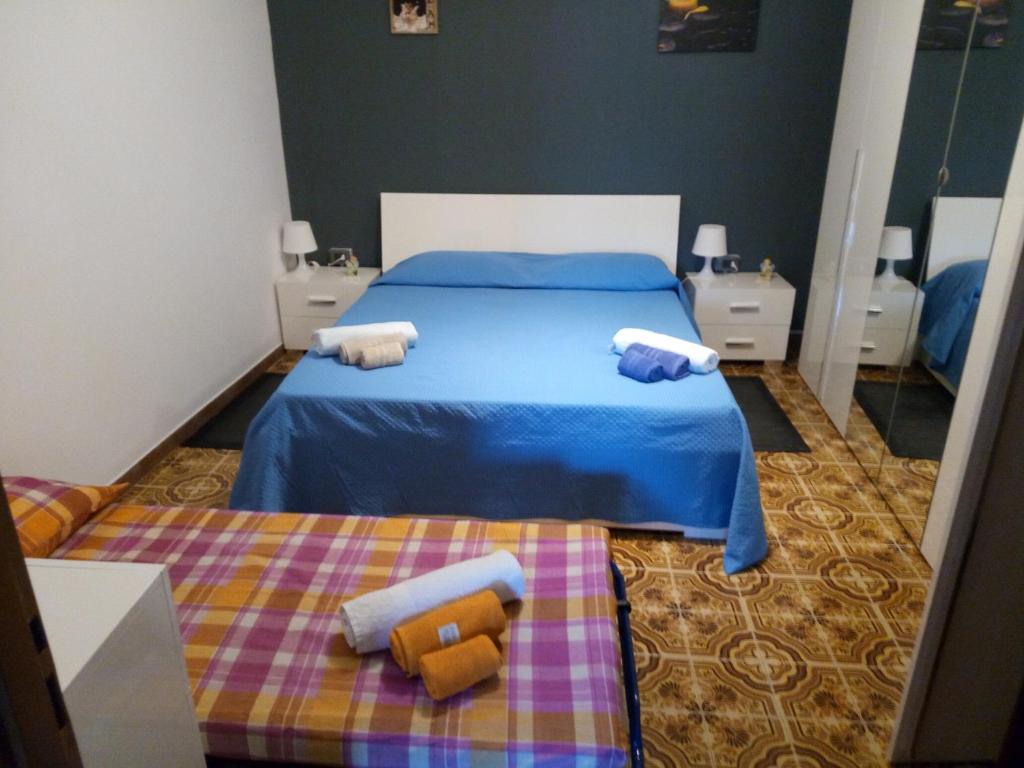 Кровать или кровати в номере Casa Vacanze "Il Carruggio"