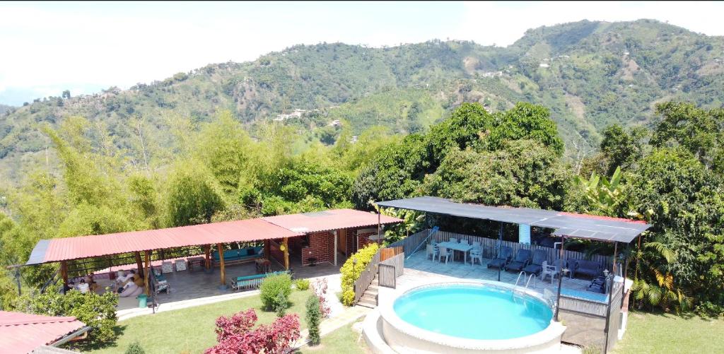 an aerial view of a house with a swimming pool at Mountain View Finca Campestre in Manizales