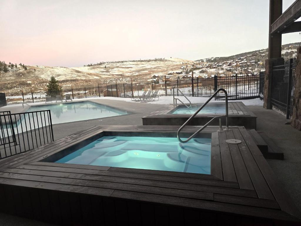 a hot tub in the middle of a patio at The Inn at Silvercreek in Granby