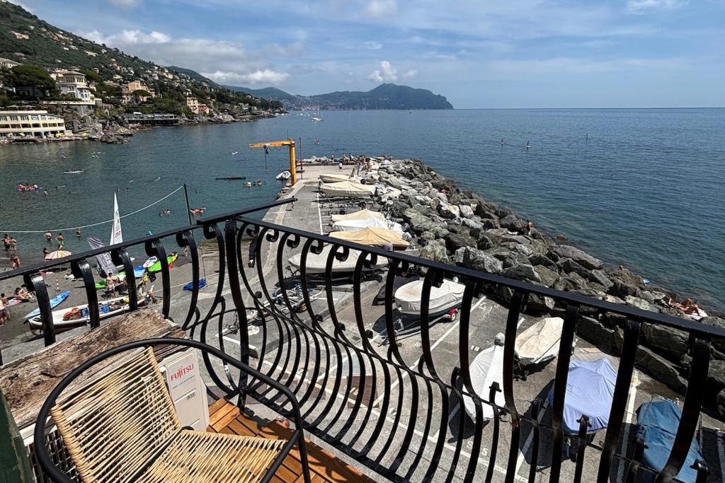 a view of a body of water from a balcony at HyggeWaves in Bogliasco