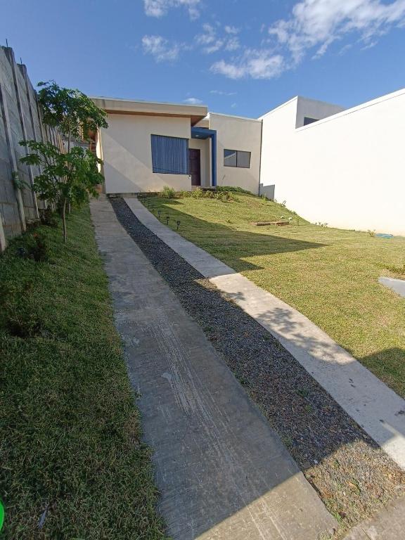 a walkway in front of a house at SJO - Casa Taccari in Grecia