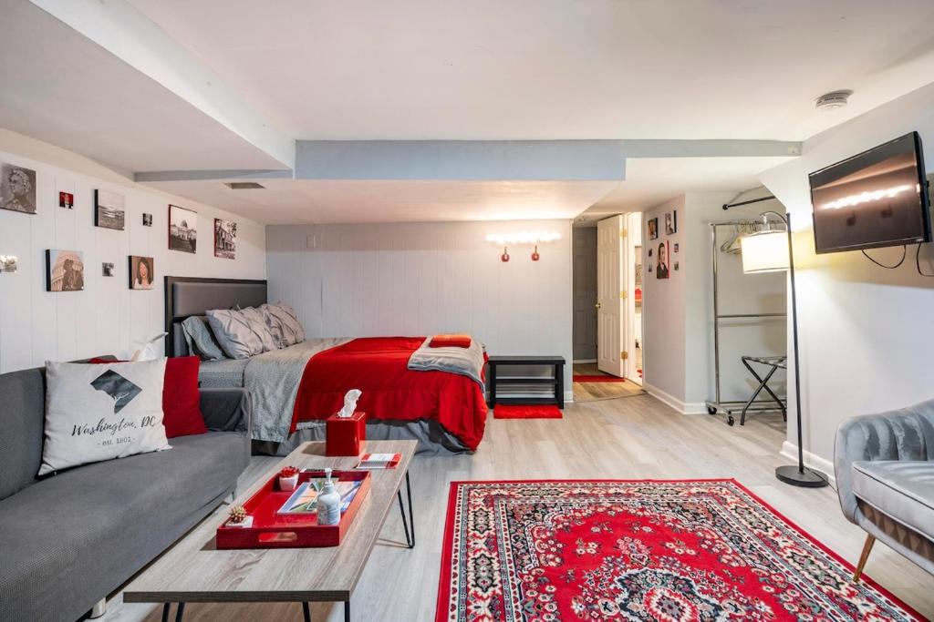 a living room with a bed and a couch at Updated Apt with Private Entry and FREE Parking in Washington, D.C.