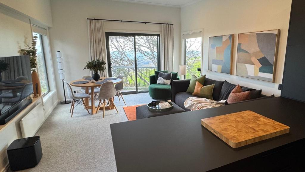 a living room with a couch and a table at Higgi Drive 6 in Mount Hotham