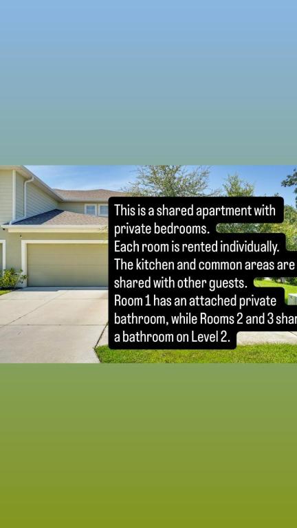 a sign in front of a house at Abi home in Brandon