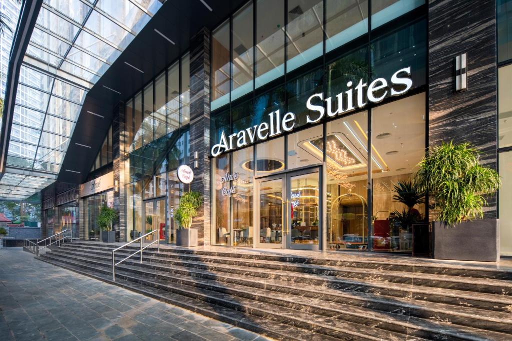 a shopping mall with stairs in front of a store at Aravelle Suites managed by 22Land in Hanoi