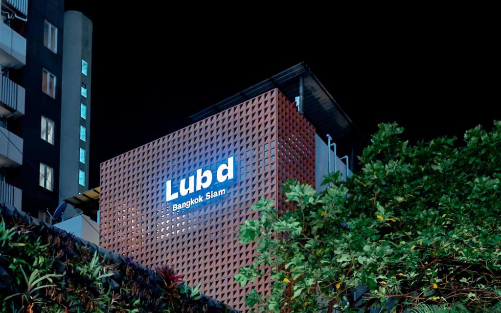 a lit up sign on the side of a building at Lub d Bangkok Siam - New Look, Across from MBK & Skytrain Access in Bangkok