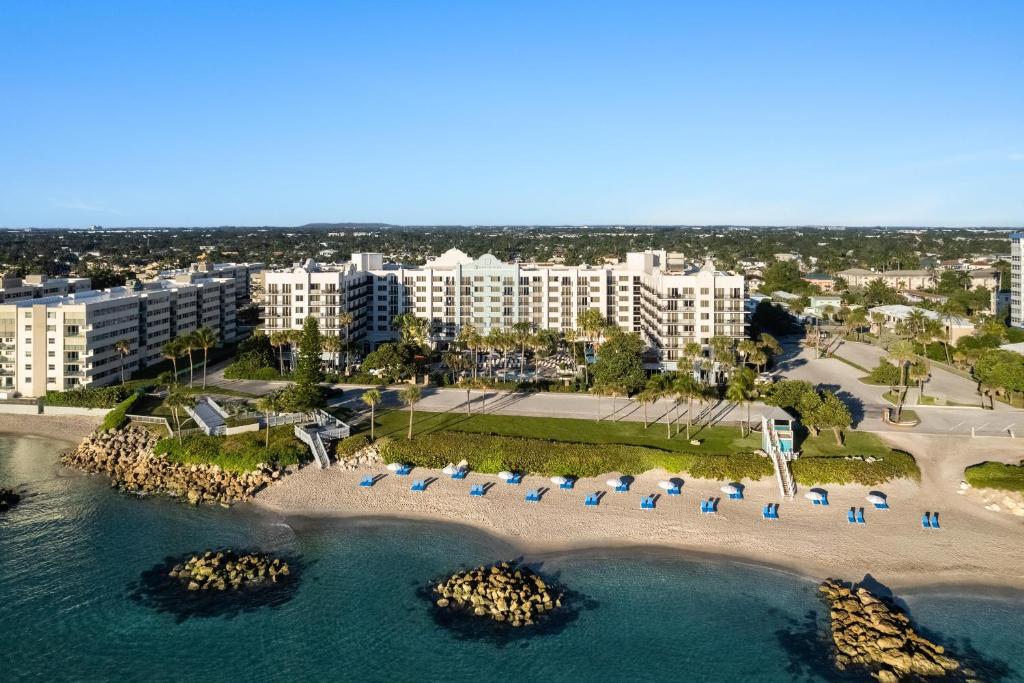 an aerial view of the beach at a resort at Embassy Suites by Hilton Deerfield Beach Resort & Spa in Deerfield Beach