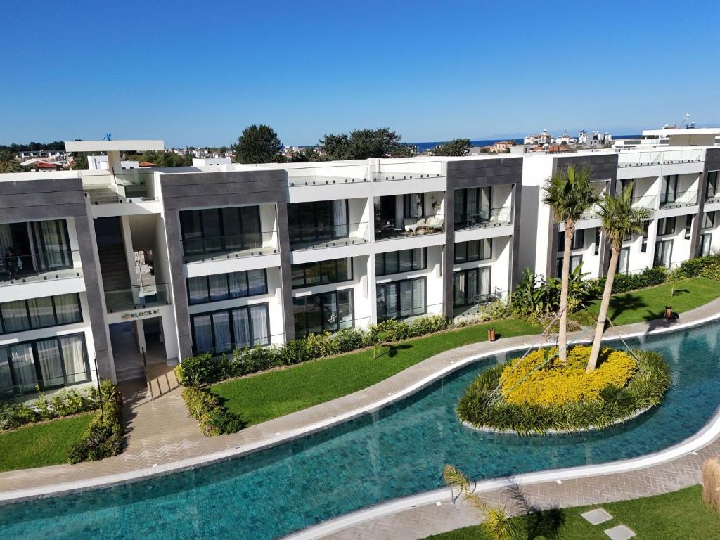 an aerial view of an apartment building with a swimming pool at Palmera - Spacious Studio with Pool View in Vasilia