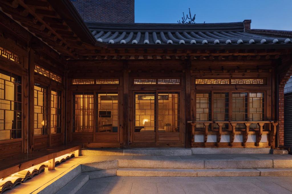 an external view of a building with windows at THE CHAE Premium Hanok Stay in Seoul