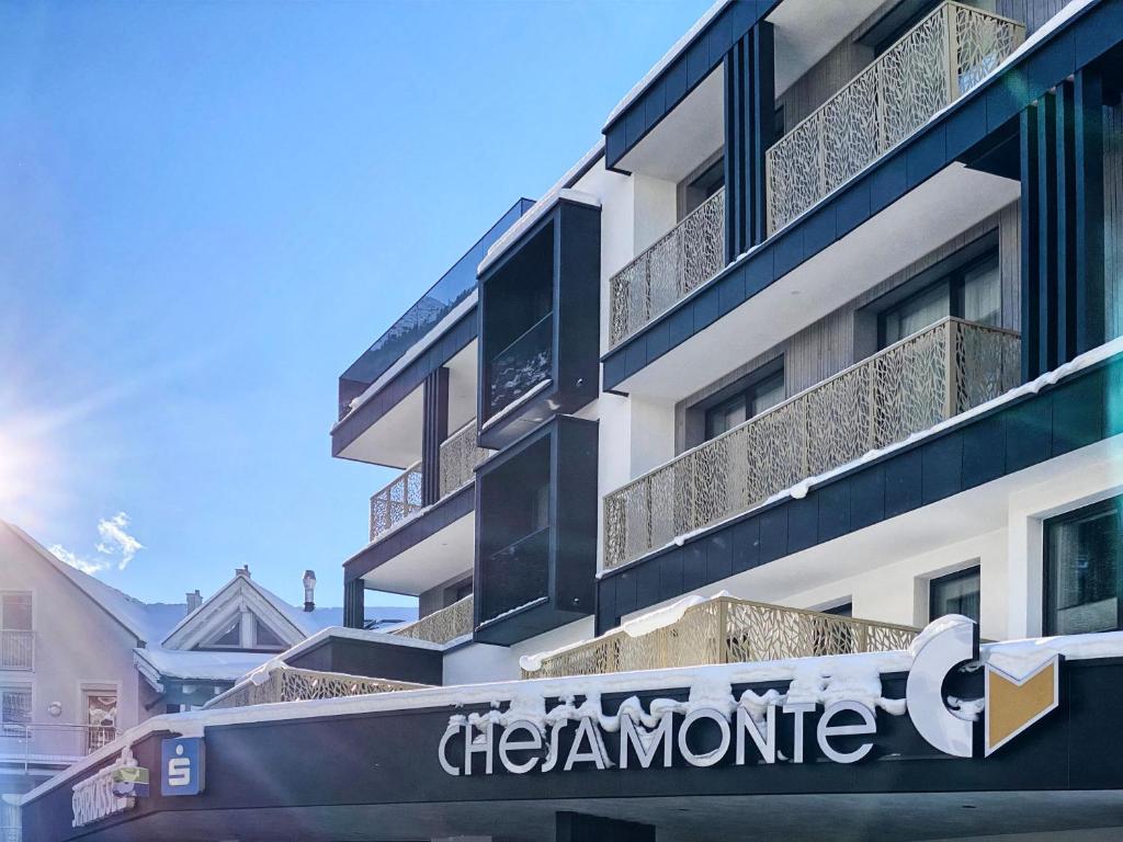 a sign on the side of a building at Appartement Chesa Monte in Ischgl