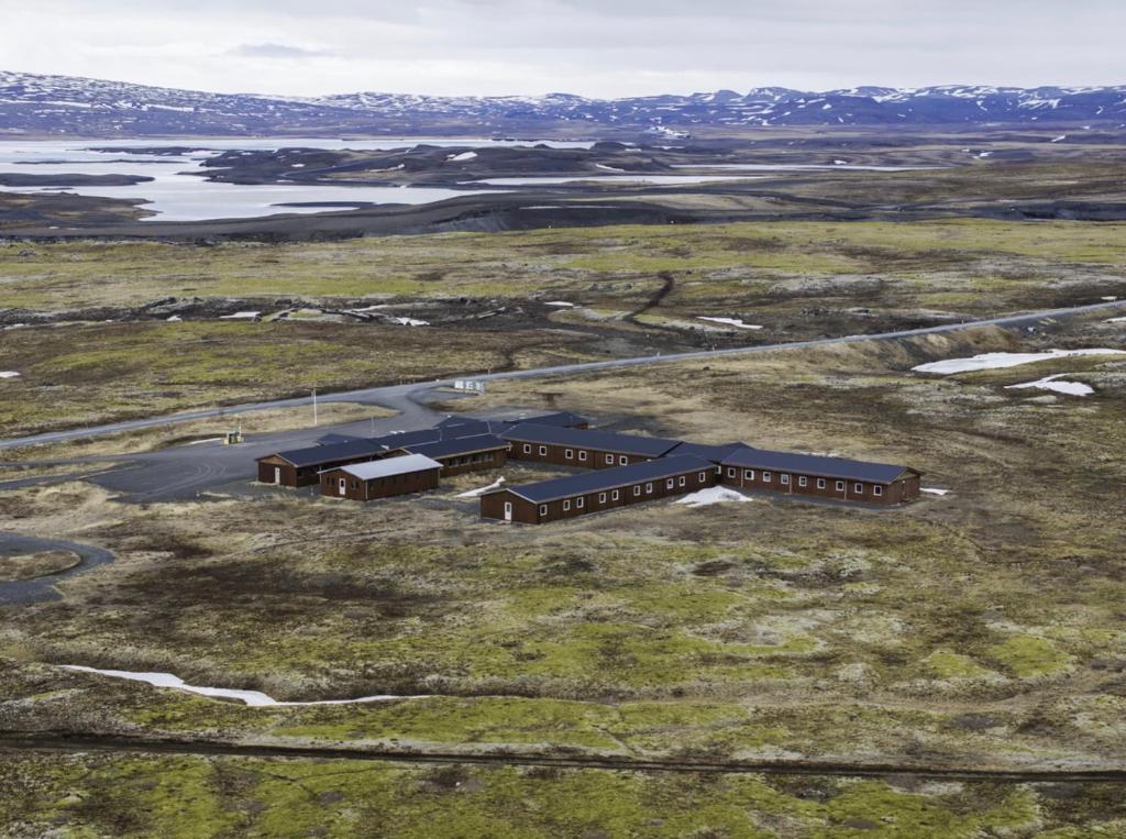 an aerial view of a building in a field at The Highland Center Hrauneyjar in Sprengisandur