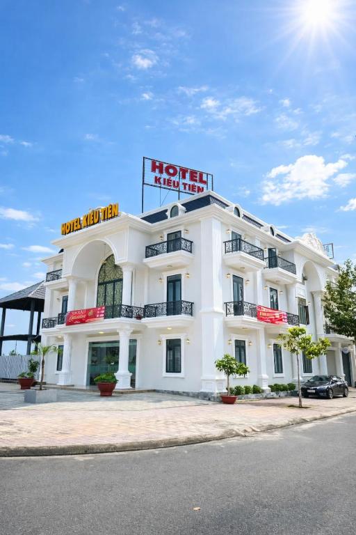a white hotel with a sign on top of it at Kiều Tiên Hotel Long Thành in Long Thành