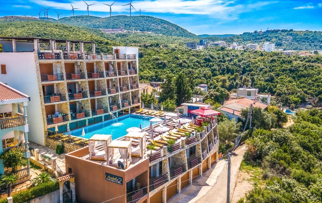an image of a hotel with a swimming pool at Arabela 2 Apartments in Utjeha
