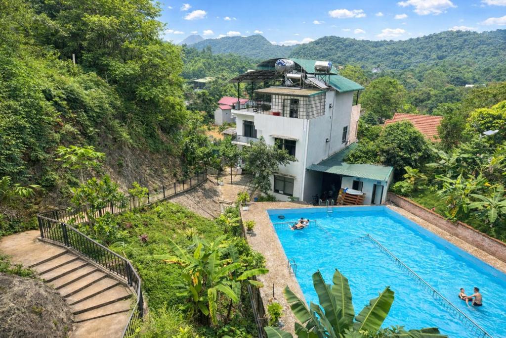 an aerial view of a house with a swimming pool at Cúc Phương Mebi Hotel in Phủ Nho Quan