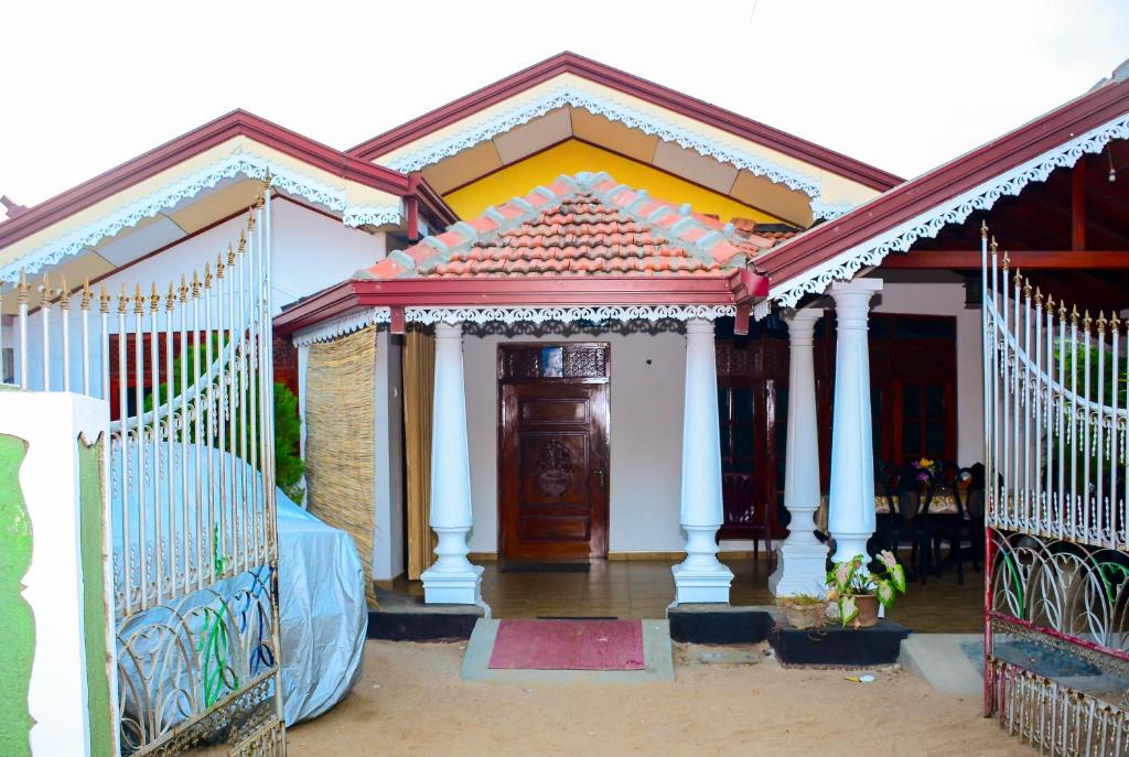 a house with a gate in front of it at Lakshmi Family Villa in Negombo