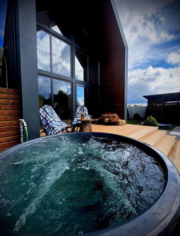 a hot tub in the backyard of a house at Chill House Dnipro in Dnipro