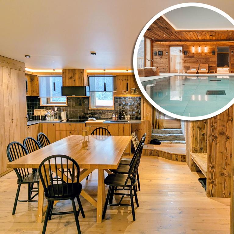 a kitchen and dining room with a table and a swimming pool at Les Airelles by Lodji in Saint-Marcel
