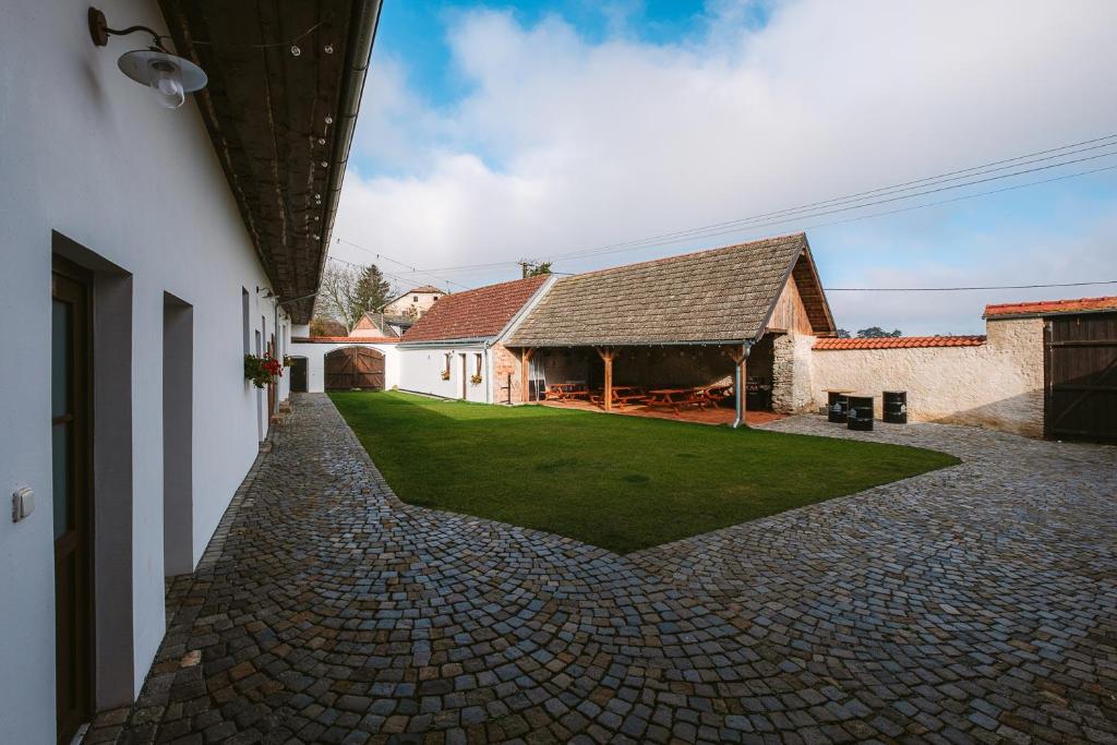 an external view of a house with a grass yard at Stodola Lesůňky in Lesŭňky