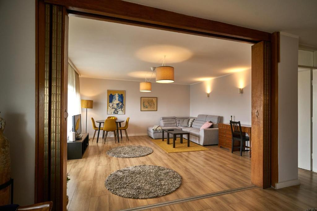 a living room with a couch and a table at 7 Heaven in Belgrade