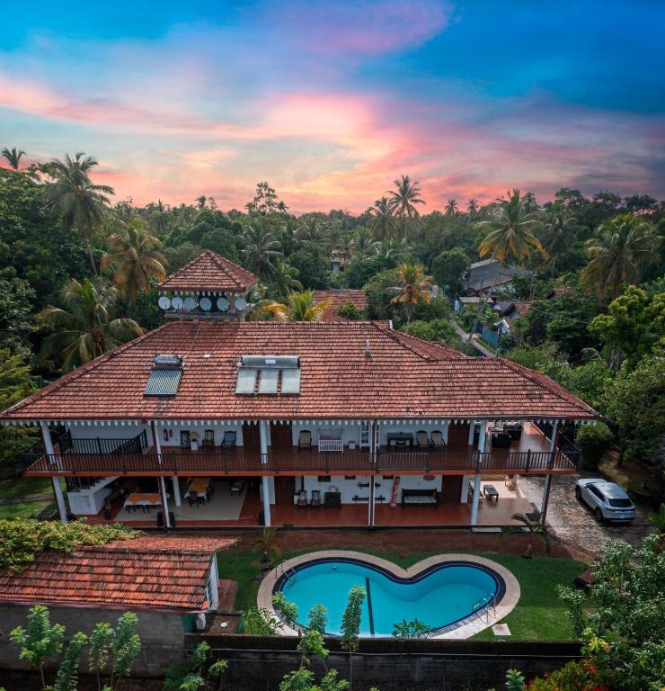 an aerial view of a house with a swimming pool at Samadhi Yoga Resort in Bentota