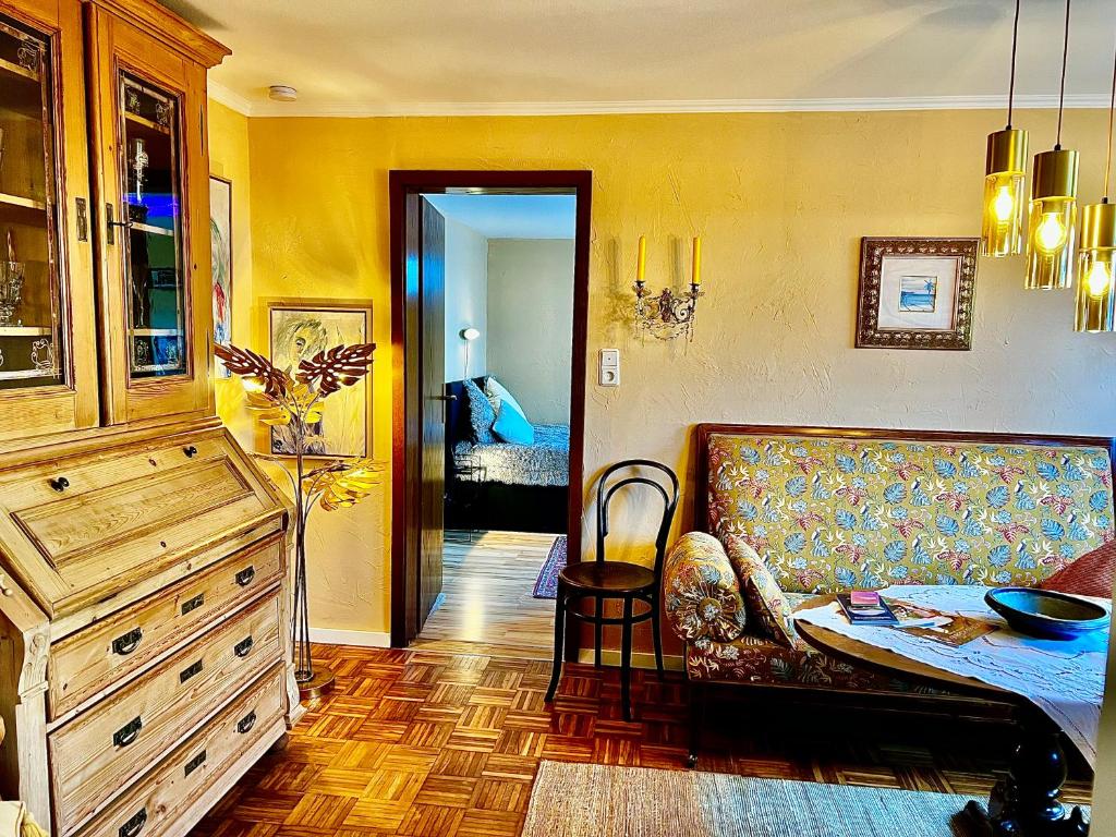 a living room with a couch and a table at Weserfeeling Apartment in Höxter in Höxter
