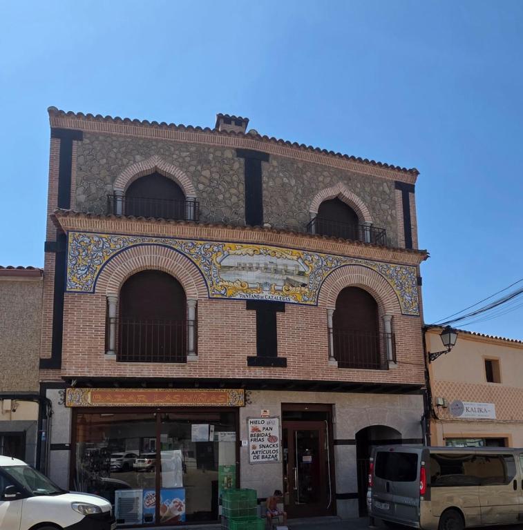 a building with a sign on the side of it at Plaza de la Cruz, 2 in Cazalegas