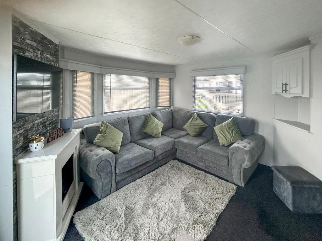 a living room with a couch and a tv at Emily's Van in Skegness