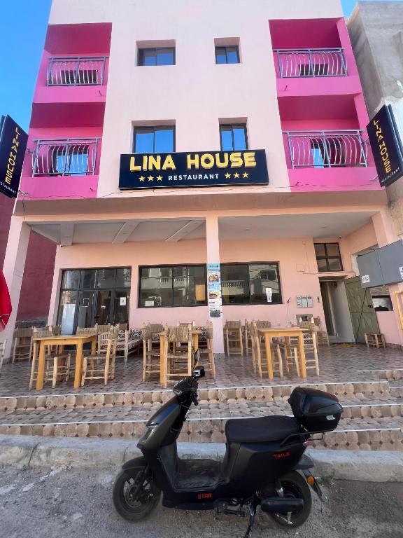 a scooter parked in front of a building at lina imsouane in Imsouane
