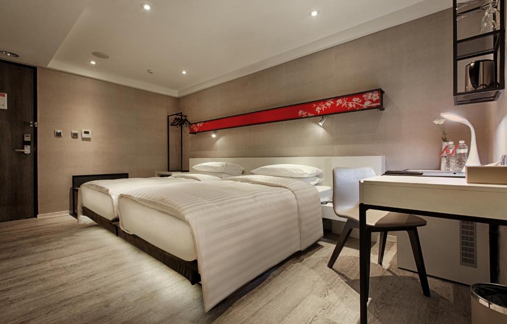 Postel nebo postele na pokoji v ubytování City Place Hotel