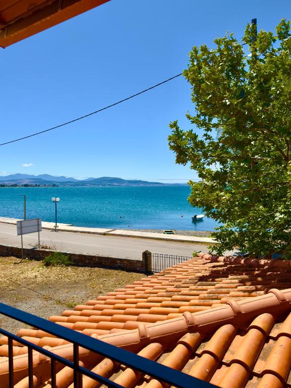 an empty stands with the ocean in the background at Kyriakos Apartments in Politika