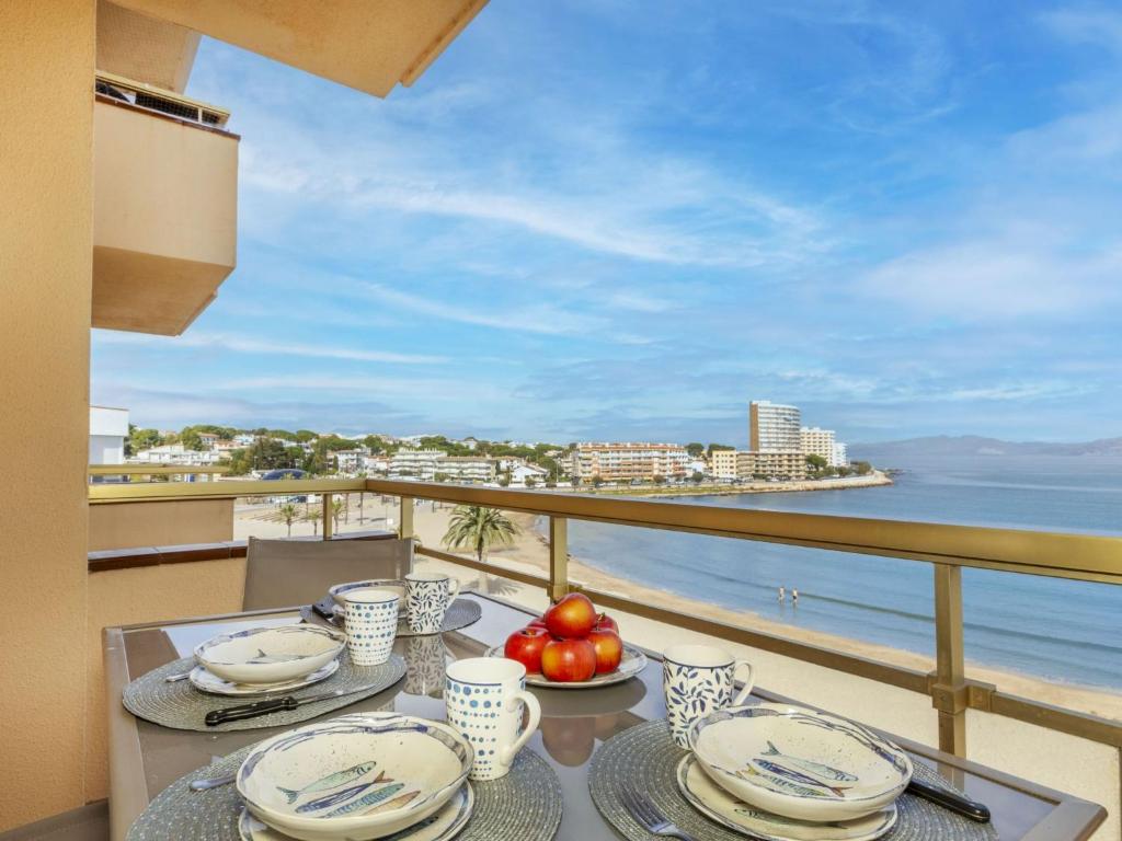 a dining table with a view of the ocean at Apartment Platja Mar by Interhome in L'Escala
