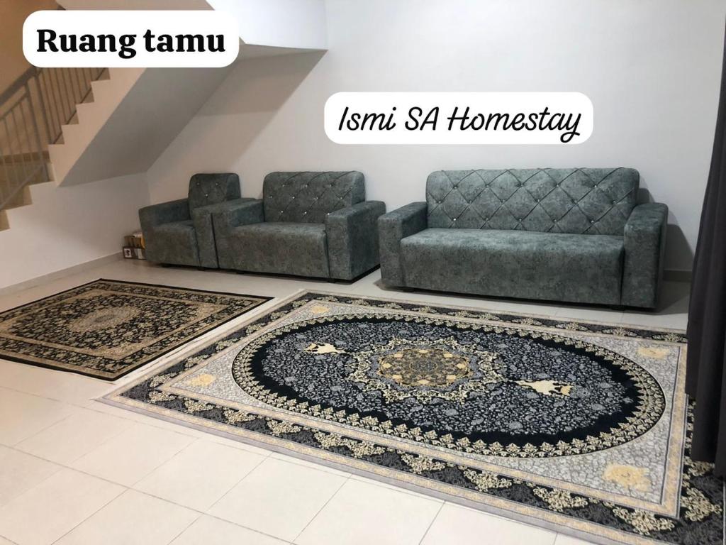 a living room with a couch and a rug at Ismi SA Homestay in Rawang