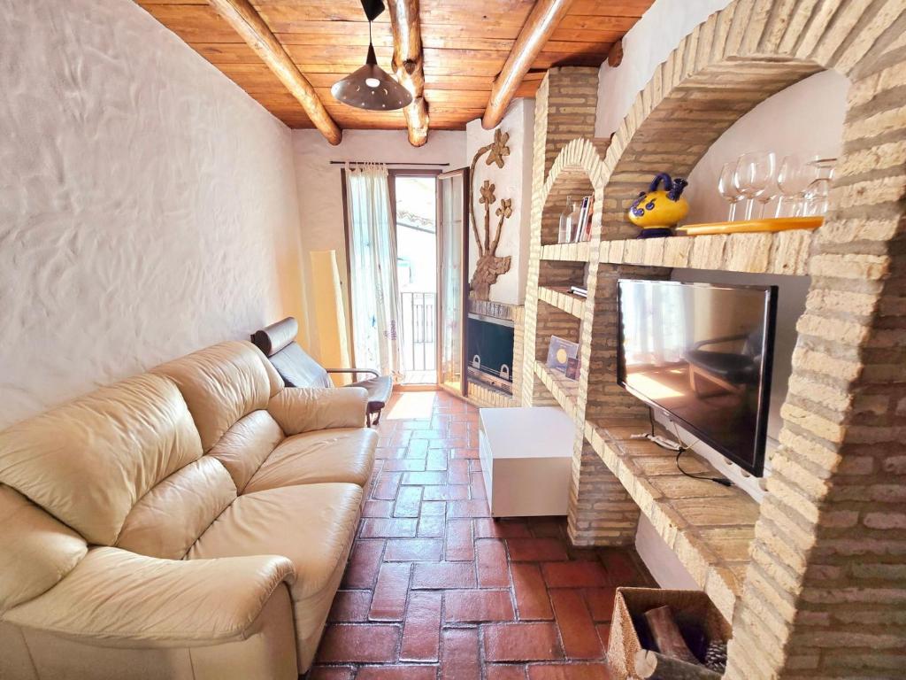 a living room with a couch and a tv at jade in Ubrique